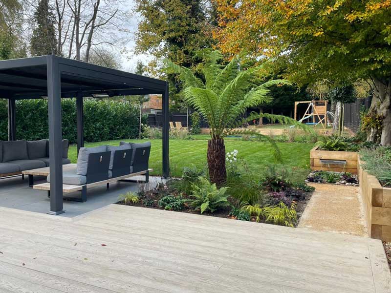 beautiful garden with modern pergola, lawns and lovely planting