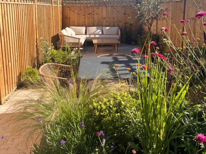 Small garden with two entertaining areas and beautiful planting