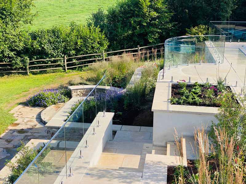 A complex terraced garden with sturdy steps and generous planting beds